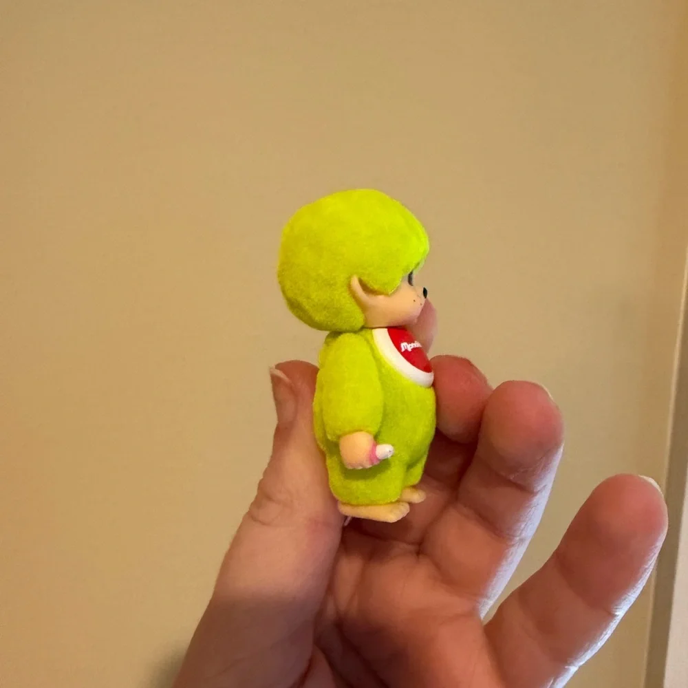 Neon yellow Monchhichi doll